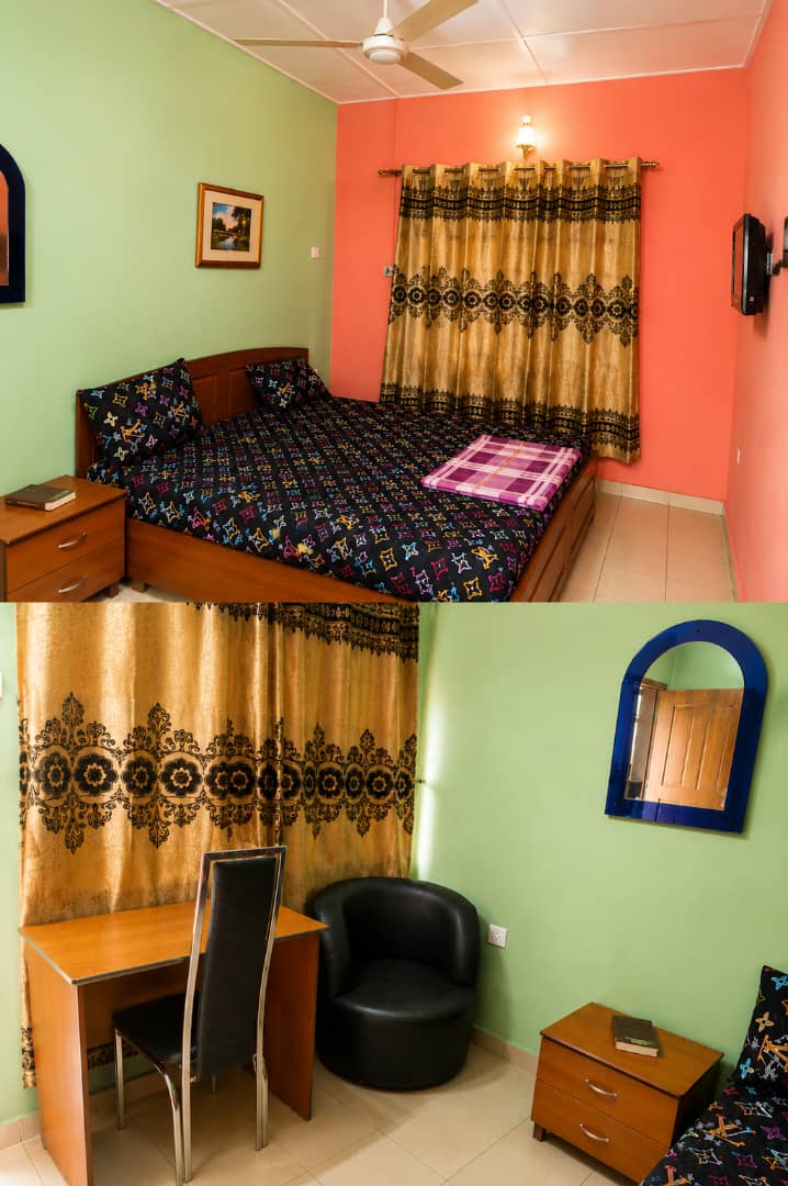 Guest room and seating area at PIKKMASTER BMV SUITE, 139 IBB Way, Calabar