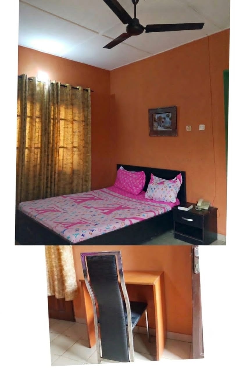 Guest room with bed and desk area at PIKKMASTER BMV SUITE, 139 IBB Way, Calabar