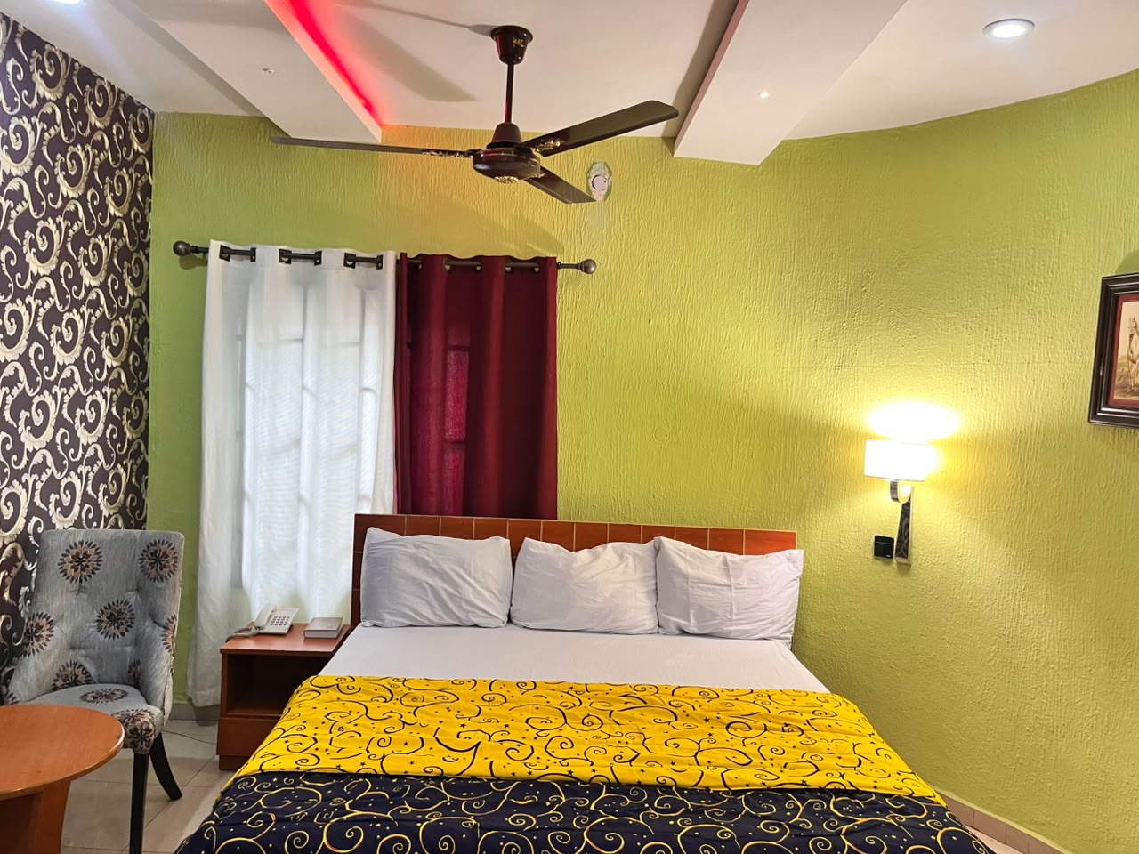 Guest room interior with bed at PIKKMASTER BMV SUITE Uyo